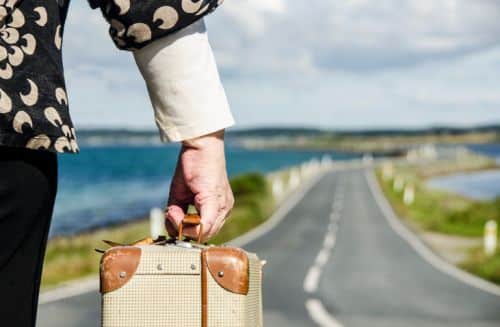 Immigrant Domestic Violence Victim with Suitcase