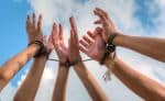 Arms of Victims of Human Trafficking Tied with Ropes