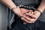 Man Arrested by ICE in Handcuffs