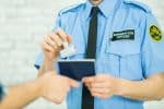 US Border Patrol Agent Stamping a Passport