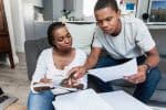 Immigrant Couple Reading Notice to Appear