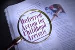 Deferred Action for Childhood Arrival on a page with magnifying glass